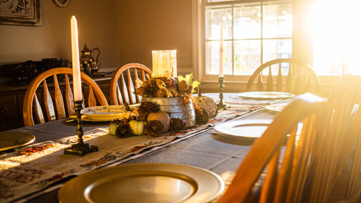 Table set for dinner with Thanksgiving decor